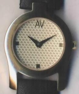 Specimen consisting of a photograph showing a watch face featuring a repeating pattern of the letters A and V. Specimen consisting of a photograph showing a watch face featuring a repeating pattern of the letters A and V.
